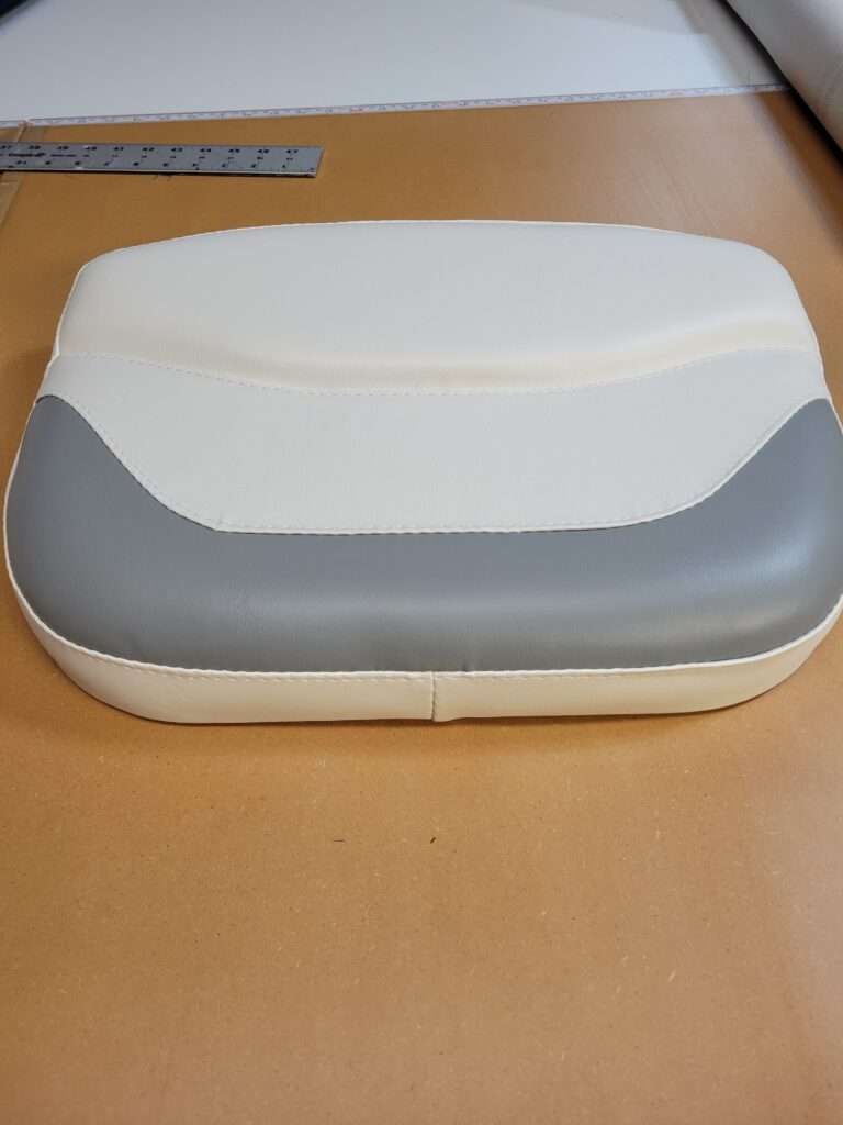 Fresh marine vinyl boat seating cushion after reupholstery by Williams Quality Covers