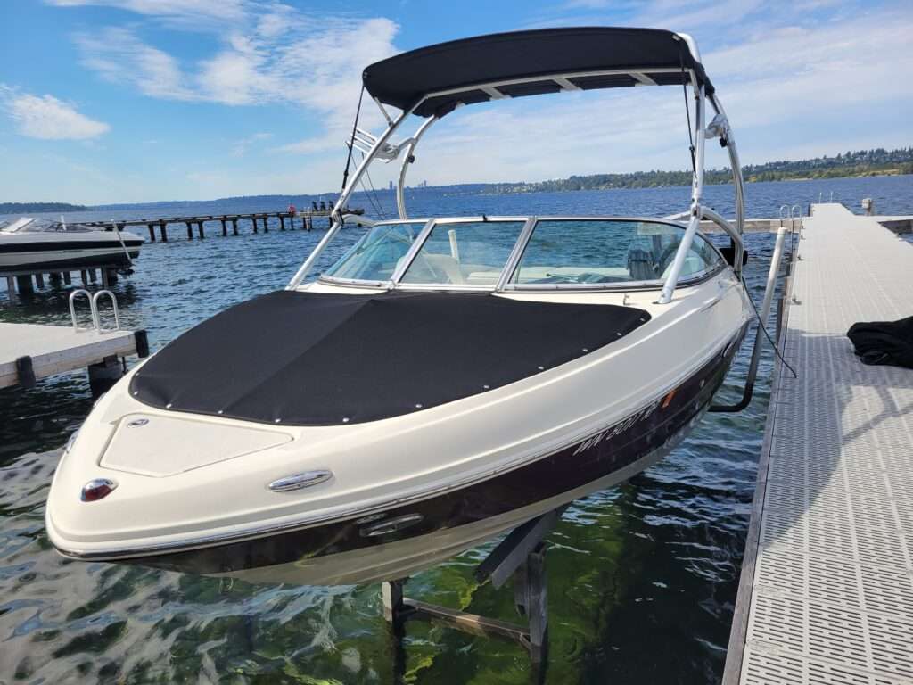 Black bimini top and cockpit cover on a bowrider wake boat