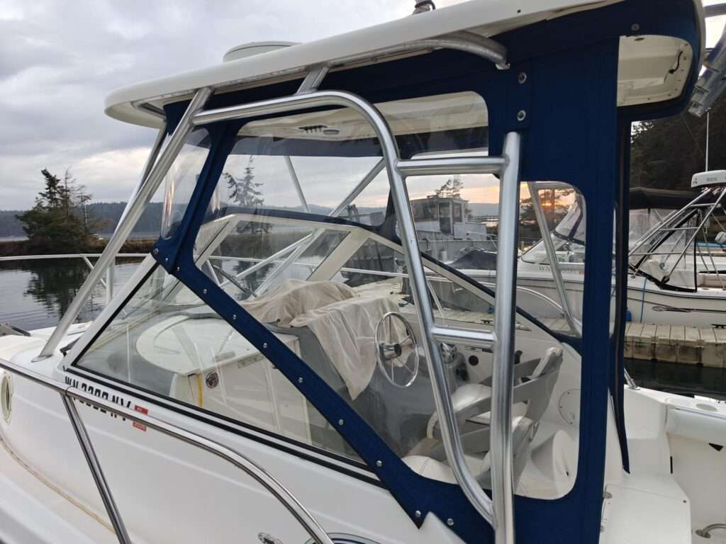 New optically clear vinyl panels in a navy blue boat enclosure