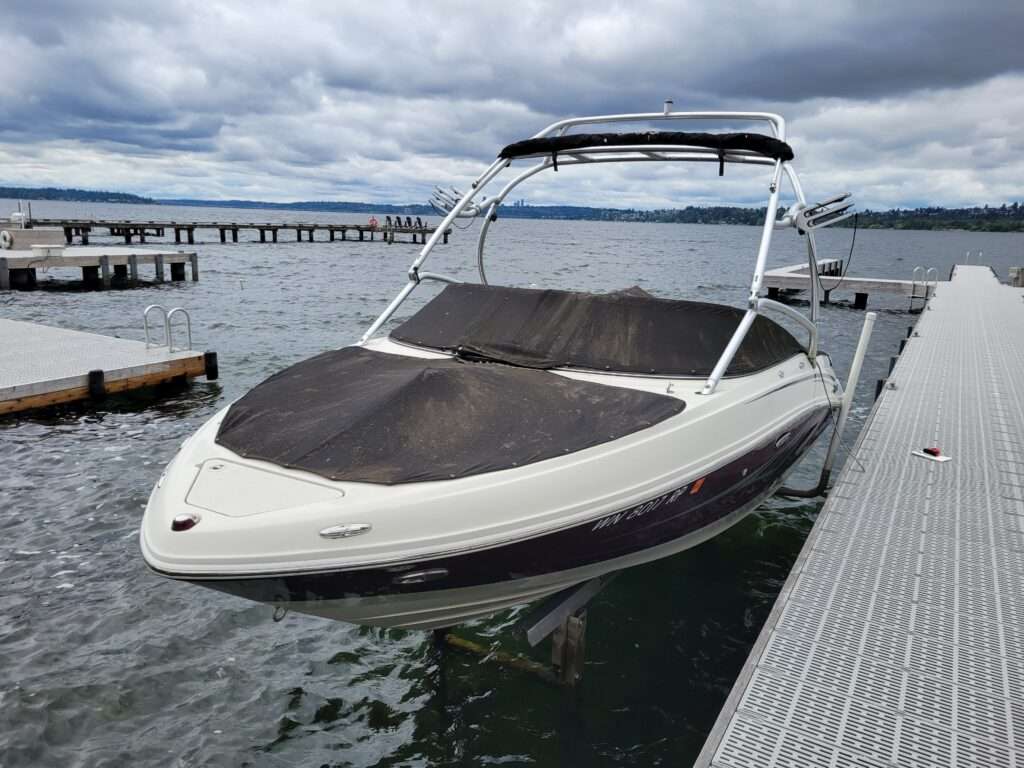 Before: worn cockpit cover on a wake boat