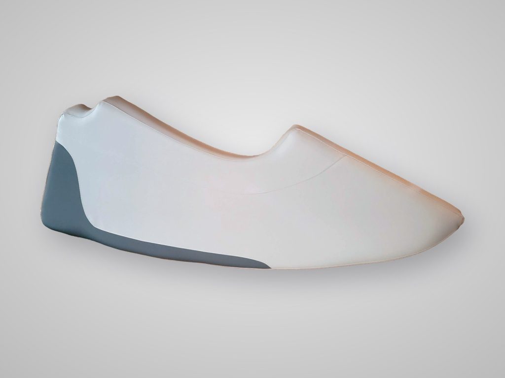 Custom two-tone white and gray marine vinyl boat cushion, rebuilt by Williams Quality Covers